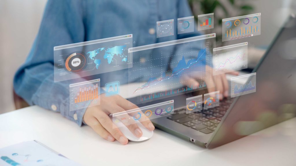 Graphiques digitalisés avec une personnes sur un ordinateur en fond